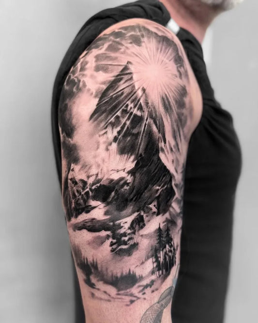 Big Black and Grey Mountain and Sun Tattoo on Men Arm by @marianne.tattoo