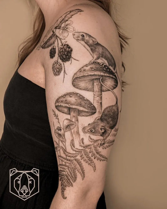 Big Black and Grey Mushroom Mice and Ferns on Women Arm Tattoo by @blackbear.ink