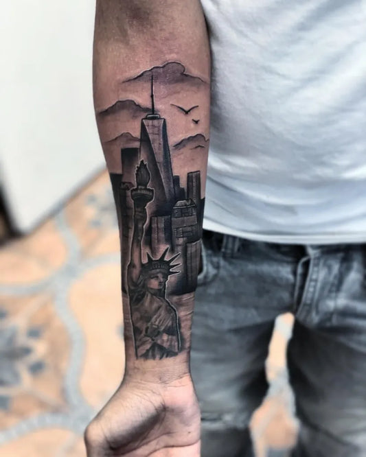 Big Black and Grey New York Skyline Statue of Liberty Tattoo on Men Inner Arm by @inknerd7