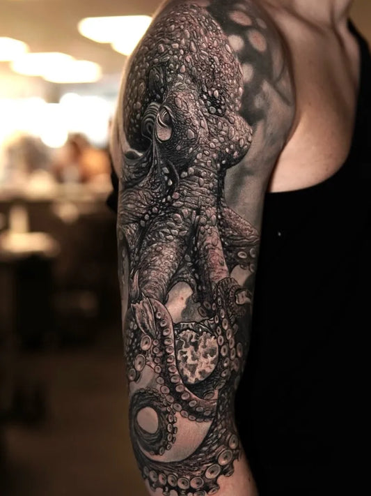 Big Black and Grey Octopus Half Sleeve Tattoo on Women Arm by @remcodevogel