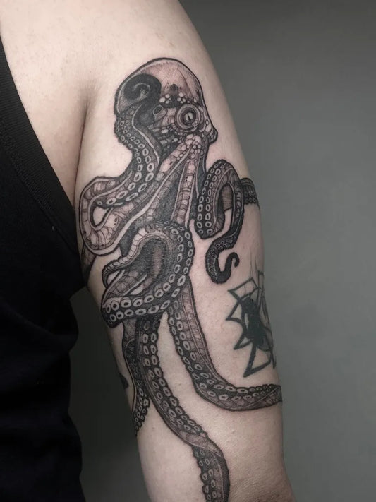 Big Black and Grey Octopus Skull Tattoo on Men Arm by @joandumez