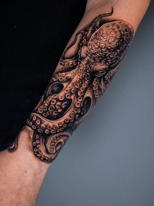 Big Black and Grey Octopus Tattoo on Men Arm by @anomalitattoo