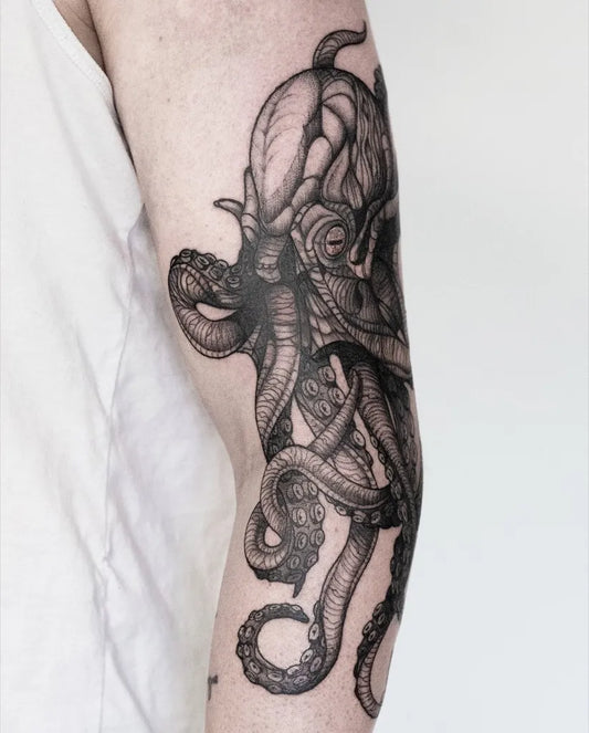 Big Black and Grey Octopus Tattoo on Men Arm by @emielvanboekel