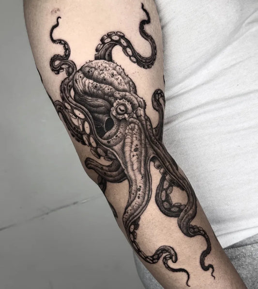 Big Black and Grey Octopus Tattoo on Men Arm by @leo.art.knives