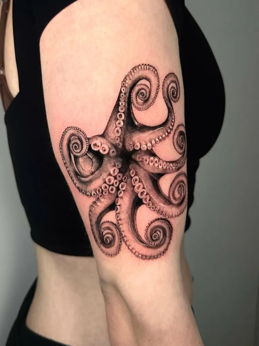 Big Black and Grey Octopus Tattoo on Women Arm by @hazy_tattoos