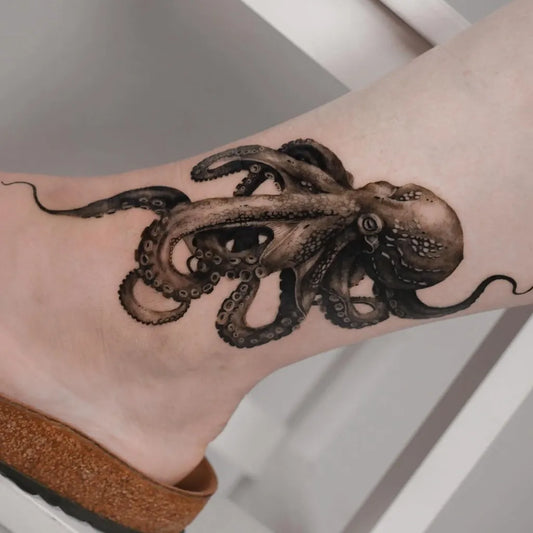 Big Black and Grey Octopus Tattoo on Women Leg by @natashapanattoni
