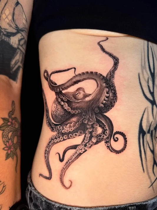 Big Black and Grey Octopus Tattoo on Women Torso by @tat.it.too