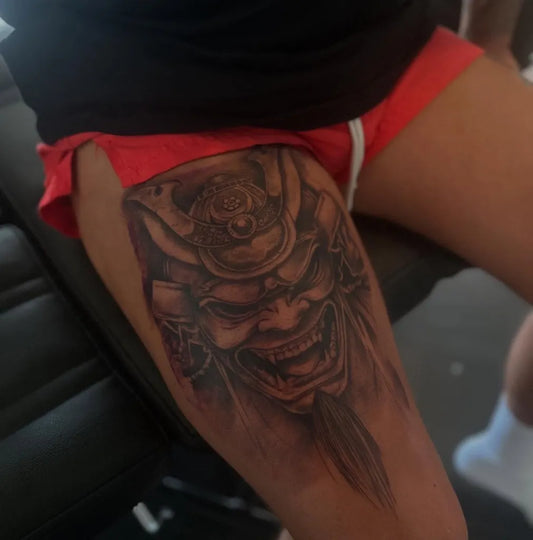 Big Black and Grey Oni Mask on Men Thigh Tattoo by @pirateislandtattooosby