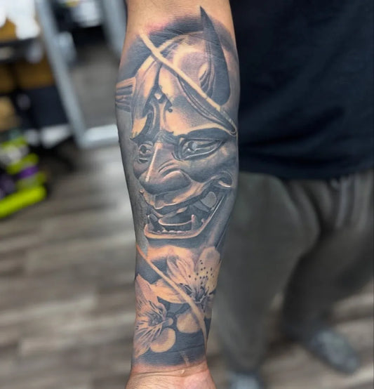 Big Black and Grey Oni Mask with Cherry Blossoms on Men Arm Tattoo by @greasymonkey310