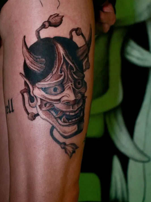 Big Black and Grey Oni Mask with Horns and Tusks on Men Thigh Tattoo by @nozi.tattoo