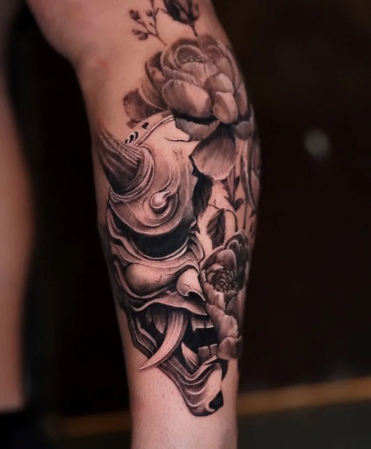 Big Black and Grey Oni Mask with Peony Flowers on Men Thigh Tattoo by @mildo_tattoo