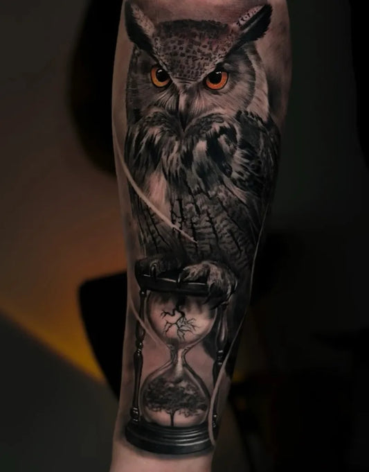 Big Black and Grey Owl and Hourglass Tattoo on Men Arm by @orlandokingstattoo