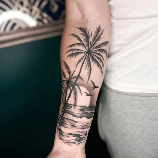 Big Black and Grey Palm Tree Beach Sunset Tattoo on Men Arm by @14arrows.tattoo