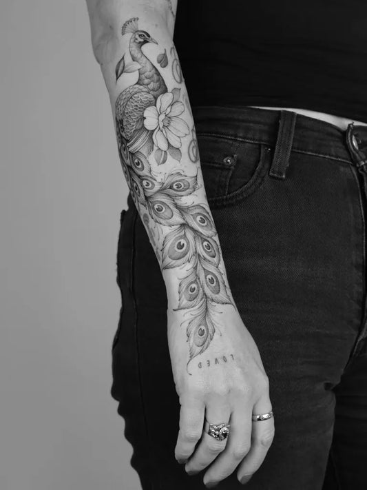 Big Black and Grey Peacock and Lotus Tattoo on Women Arm by @hannahnova_tattoo