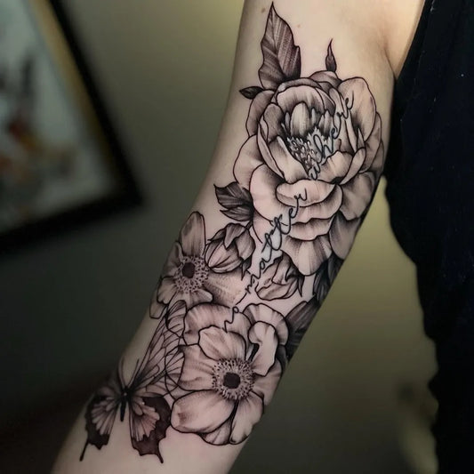 Big Black and Grey Peony and Butterfly Tattoo on Women Inner Arm by @sarahdurnotattoos