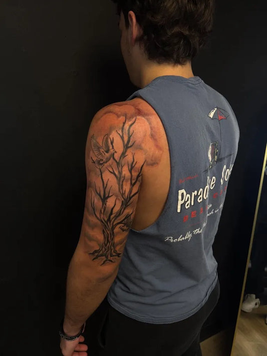 Big Black and Grey Poison Tree with Bird on Men Upper Arm Tattoo by @tulsa_tattoos