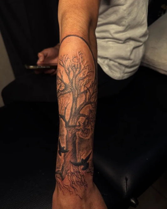 Big Black and Grey Poison Tree with Birds on Men Arm Tattoo by @ballesteros_tatts