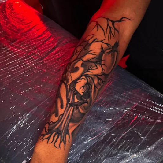 Big Black and Grey Poison Tree with Face and Branches on Men Arm Tattoo by @tattedbyvisions