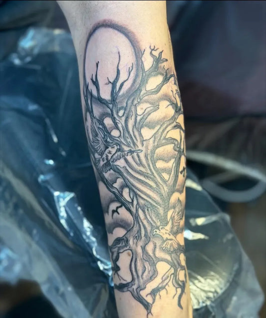 Big Black and Grey Poison Tree with Moon and Branches on Men Arm Tattoo by @goud.tattoo