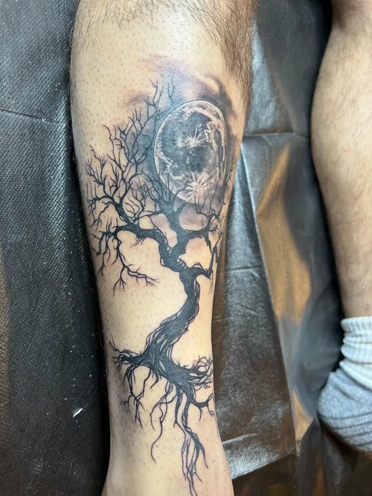 Big Black and Grey Poison Tree with Moon and Branches on Men Leg Tattoo by @foolish_tattoos