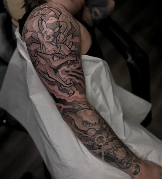 Big Black and Grey Pokemon Battle Tattoo on Women Shoulder by @markm_tatts
