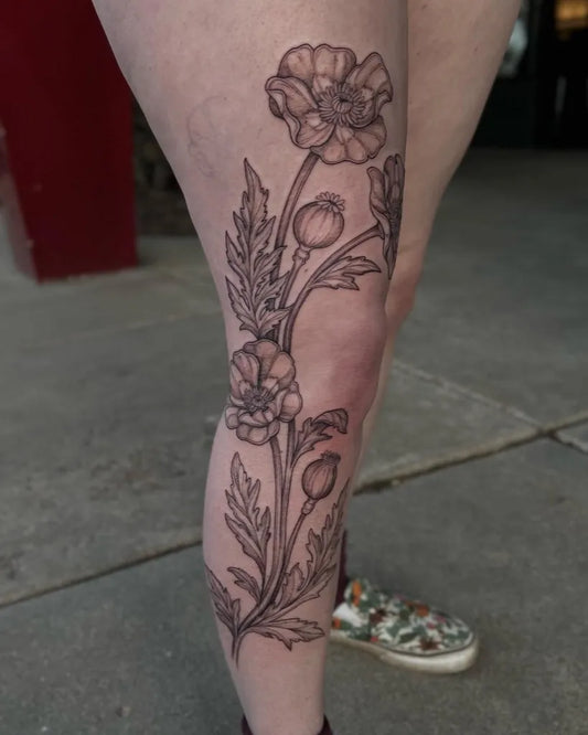 Big Black and Grey Poppy Flower Tattoo on Women Leg by @manders.art
