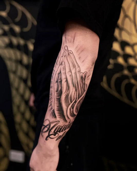 Big Black and Grey Praying Hands with Praying Hands Tattoo on Men Arm by @blackblossomtattoos