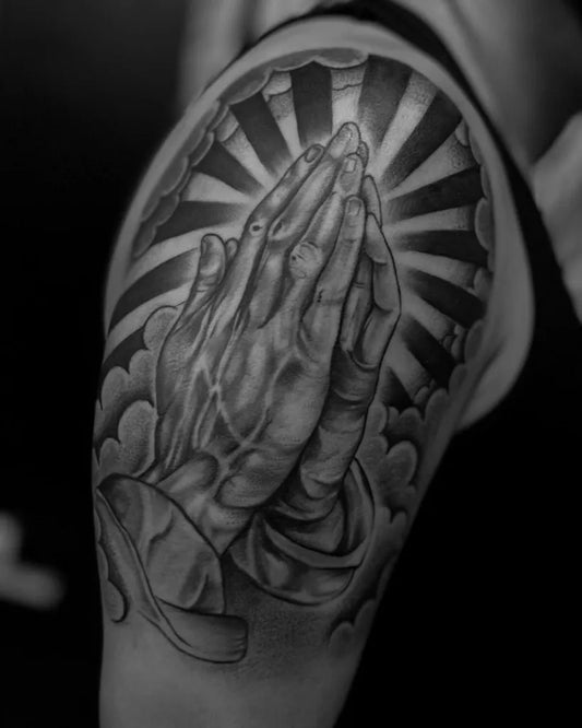 Big Black and Grey Praying Hands with Rays and Clouds Tattoo on Women Shoulder by @blacksquirrelomaha