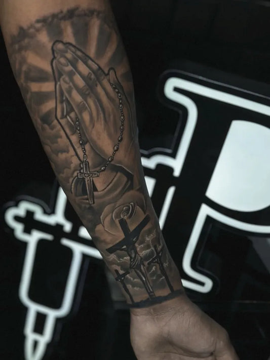 Big Black and Grey Praying Hands with Rosary and Cross Tattoo on Men Arm by @cassius_tatuador