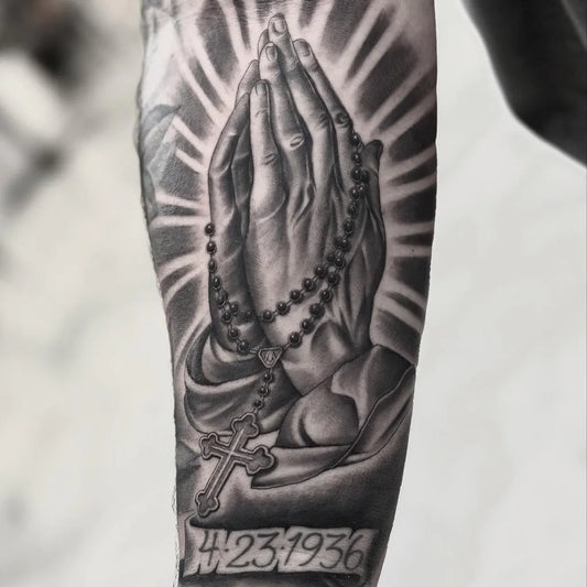Big Black and Grey Praying Hands with Rosary and Date Tattoo on Men Arm by @c.aketatss