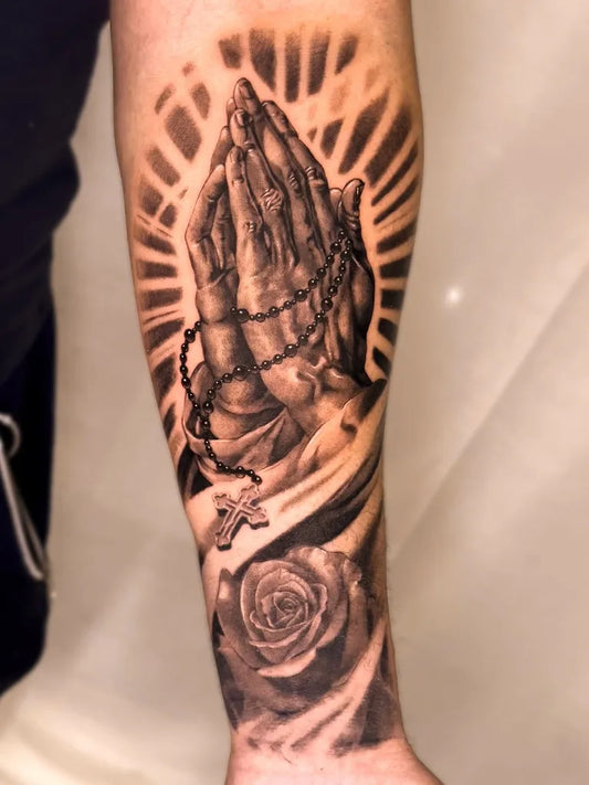 Big Black and Grey Praying Hands with Rosary and Rose Tattoo on Men Arm by @marusia_tattoo