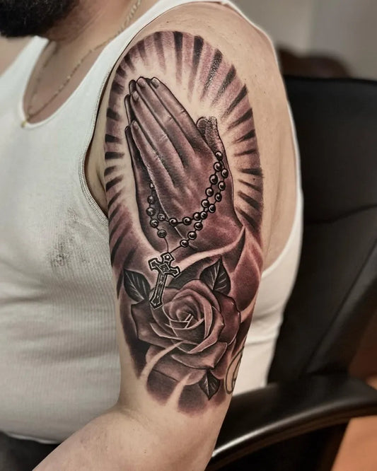 Big Black and Grey Praying Hands with Rosary and Rose Tattoo on Men Shoulder by @tatuajesi.r
