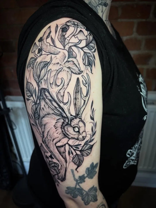 Big Black and Grey Rabbit and Flowers Nature Tattoo on Women Arm by @bexpriesttattoos