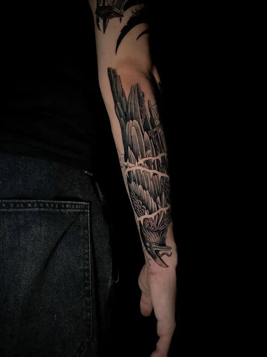 Big Black and Grey Raven and Mountains on Men Arm Tattoo by @angelle.sab