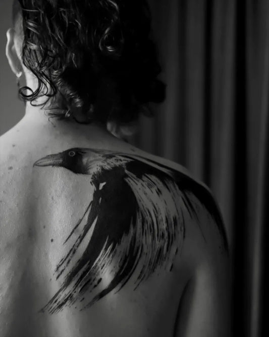 Big Black and Grey Raven on Men Back Tattoo by @merievermeij