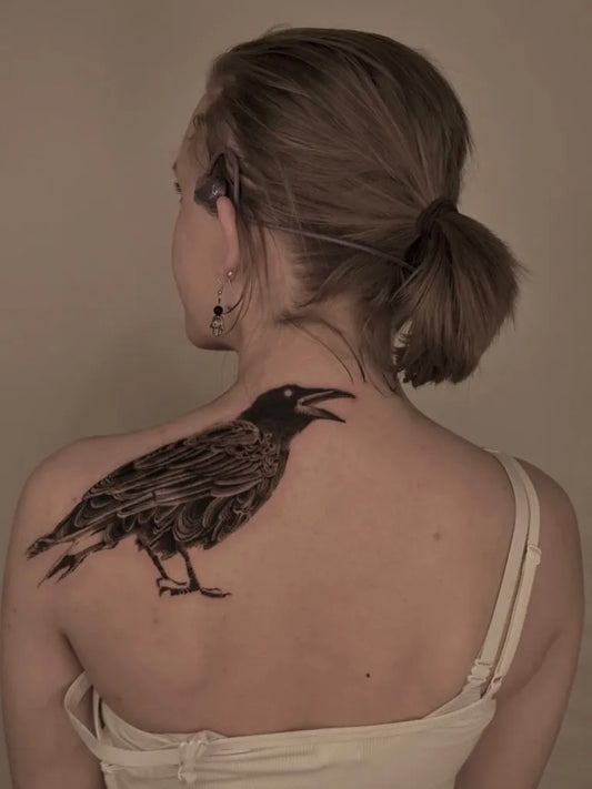 Big Black and Grey Raven on Women Back Tattoo by @avenntattoo