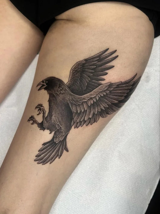 Big Black and Grey Raven on Women Thigh Tattoo by @melwest.tattoos