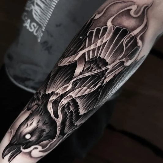 Big Black and Grey Raven with Flames on Men Arm Tattoo by @shelbytattoosllc