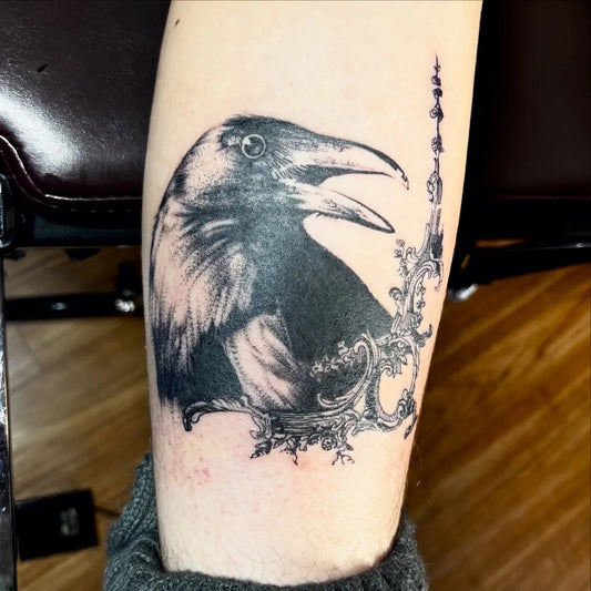 Big Black and Grey Raven with Ornamental Frame on Women Arm Tattoo by @gweepers