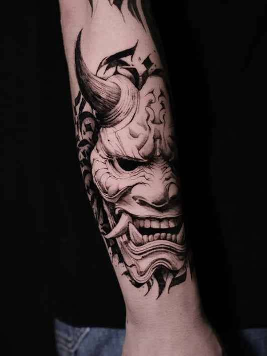 Big Black and Grey Realism Oni Mask with Horns and Flames on Men Arm Tattoo by @art7ink