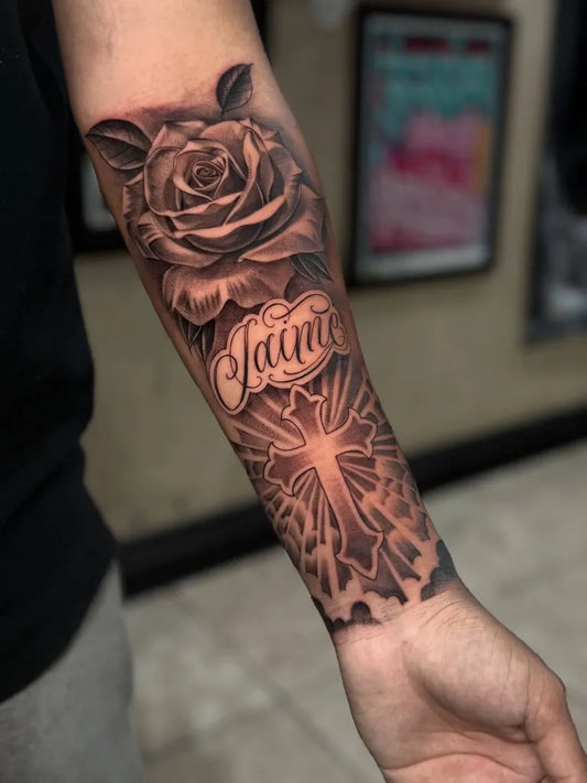 Big Black and Grey Rose Cross and Name Tattoo on Men Arm by @steven_lowrider