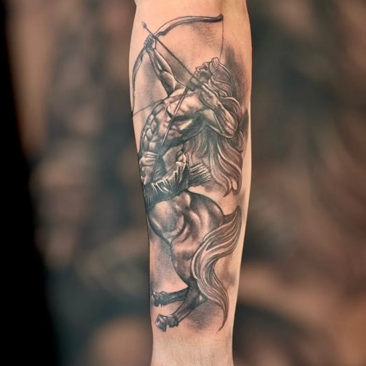 Big Black and Grey Sagittarius Centaur Tattoo on Men Arm by @markgilltattoo