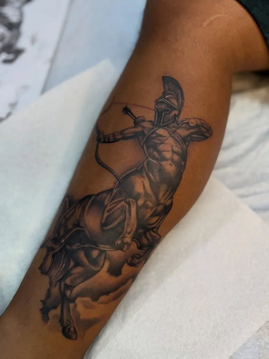 Big Black and Grey Sagittarius Tattoo on Men Leg by @shootermgavin_