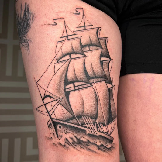 Big Black and Grey Sailing Ship Tattoo on Women Thigh by @vik.b.tattoo
