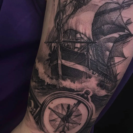 Big Black and Grey Sailing Ship and Compass Nautical Tattoo on Men Arm by @luciantatar_