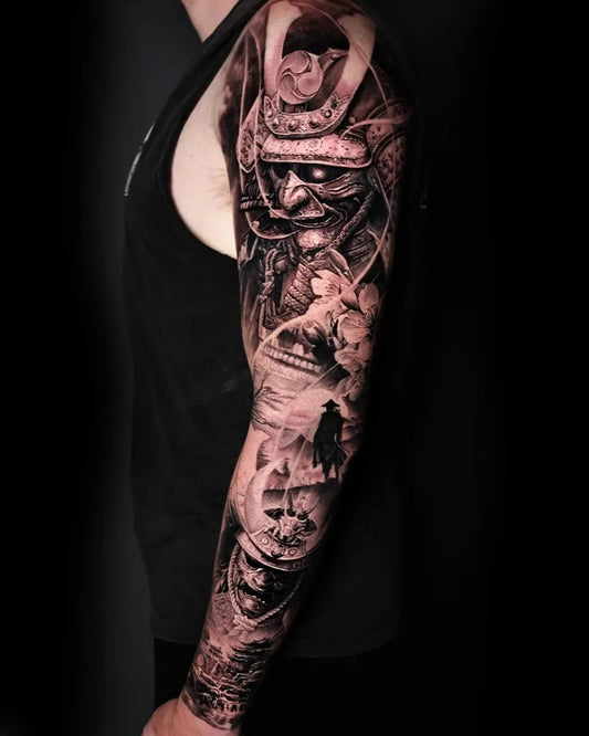 Big Black and Grey Samurai Hannya Mask with Flowers Tattoo on Men Arm by @rimen_tattoo
