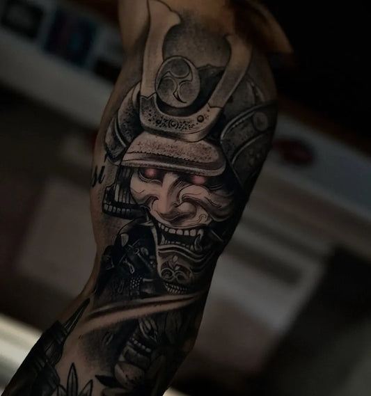 Big Black and Grey Samurai Mask and Armor Tattoo on Men Arm by @shicdepablo_tattoo