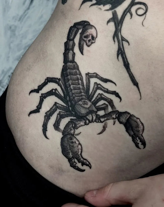 Big Black and Grey Scorpion with Skull and Rose on Women Hip Tattoo by @bloodstonetattoos