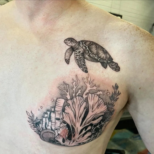 Big Black and Grey Sea Turtle and Coral Tattoo on Men Chest by @bethanymerrillart