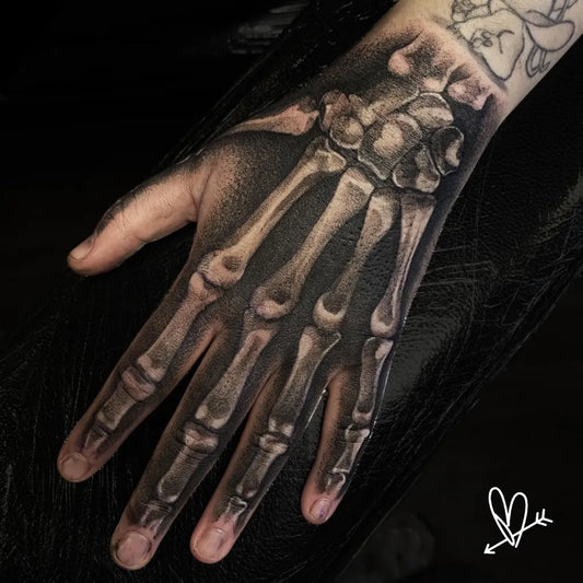 Big Black and Grey Skeleton Hand Tattoo on Men Hand by @paulbirchmore_tattoo